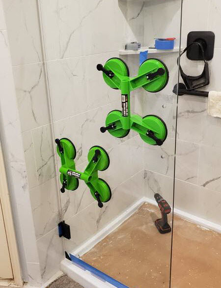 Dent puller used to install glass shower door